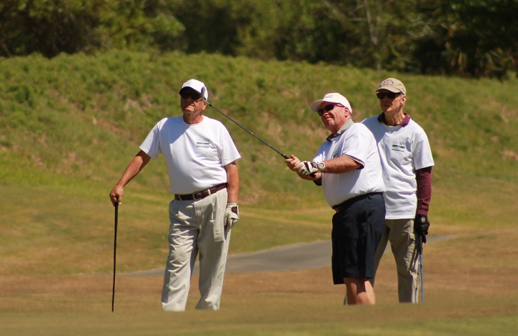 three men playing golf at leland games