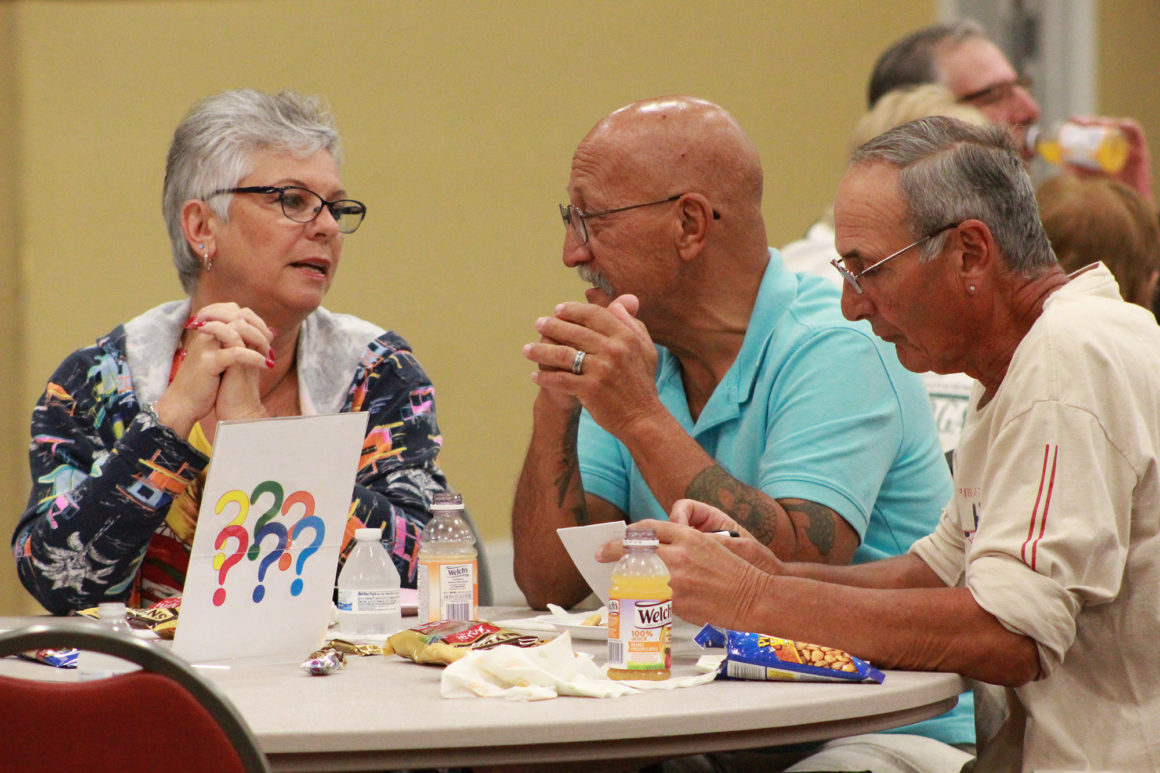 three elderly people participating in the trivia tournament at leland games 2018